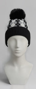 Black and white argyle pom pom beanie on mannequin
