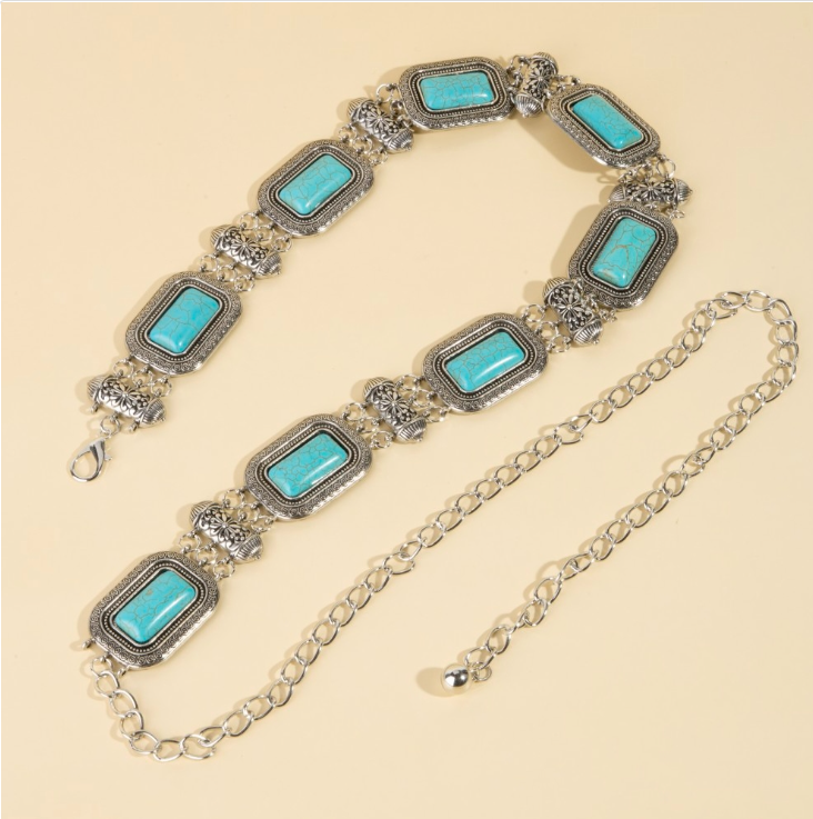 Silver turquoise rectangle concho chain belt on cream background